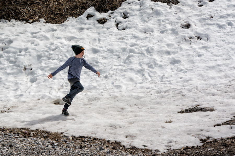 Child running in snow on Mount Charleston photo