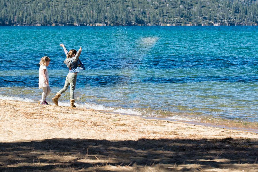 Little girl throwing sand Tahoe photo